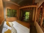 Double bed with tree views